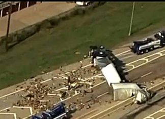 Big truck overturned on the highway, people fell from the car. Big truck overturned on the highway, people fell from the car.