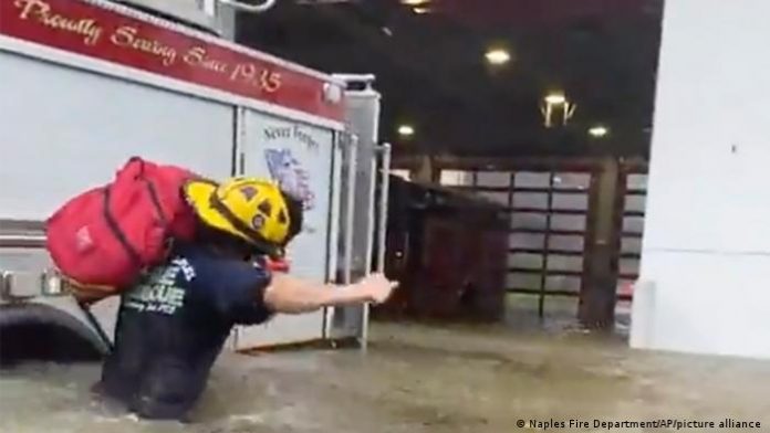 Naples Fire Department vehicles in waist-deep water