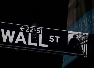 Demoralized investors bring down Wall Street FILE PHOTO : A Wall St. street sign is seen near the New York Stock Exchange (NYSE) in New York City, U.S., September 17, 2019. REUTERS/Brendan McDermid//File Photo