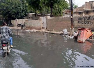 Germany triples flood aid to Pakistan | Current Asia | DW Moped riders drive on flooded road