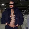 Photo: Rihanna flaunting baby bump in a bold black front open top