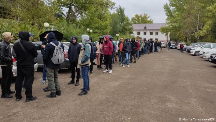 Queue of Russians near the Citizen Service Center in Almaty where migrants are registered