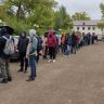 Queue of Russians near the Citizen Service Center in Almaty where migrants are registered