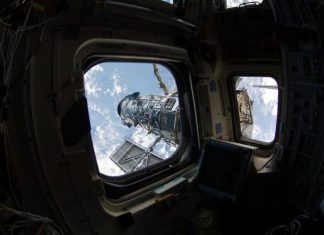 What if SpaceX helped NASA extend the life of the Hubble telescope? Hubble seen from the window of Atlantis in 2009.